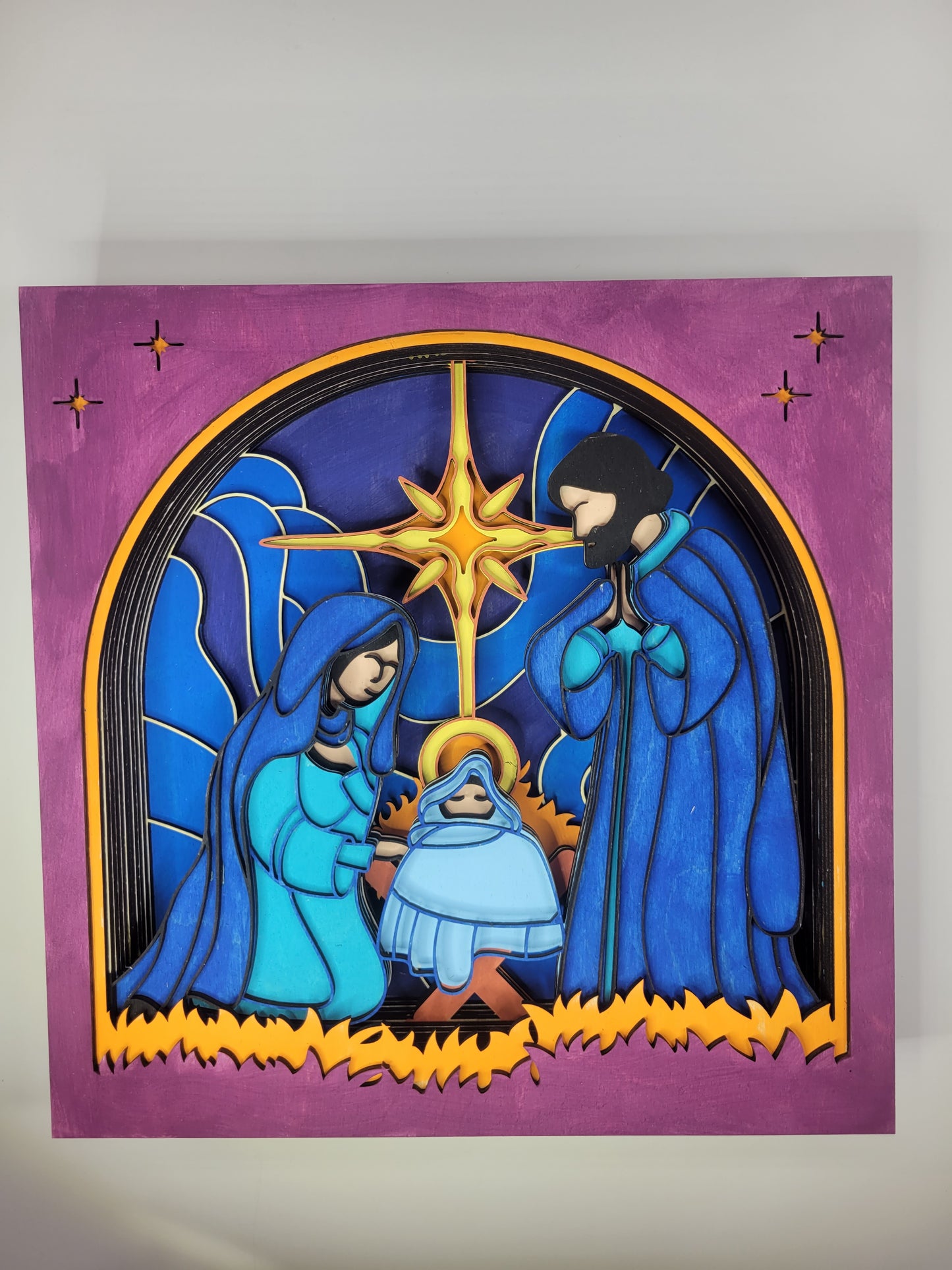 Hand-painted shadow box depicting a nativity scene with multiple layers of Baltic Birch Plywood.